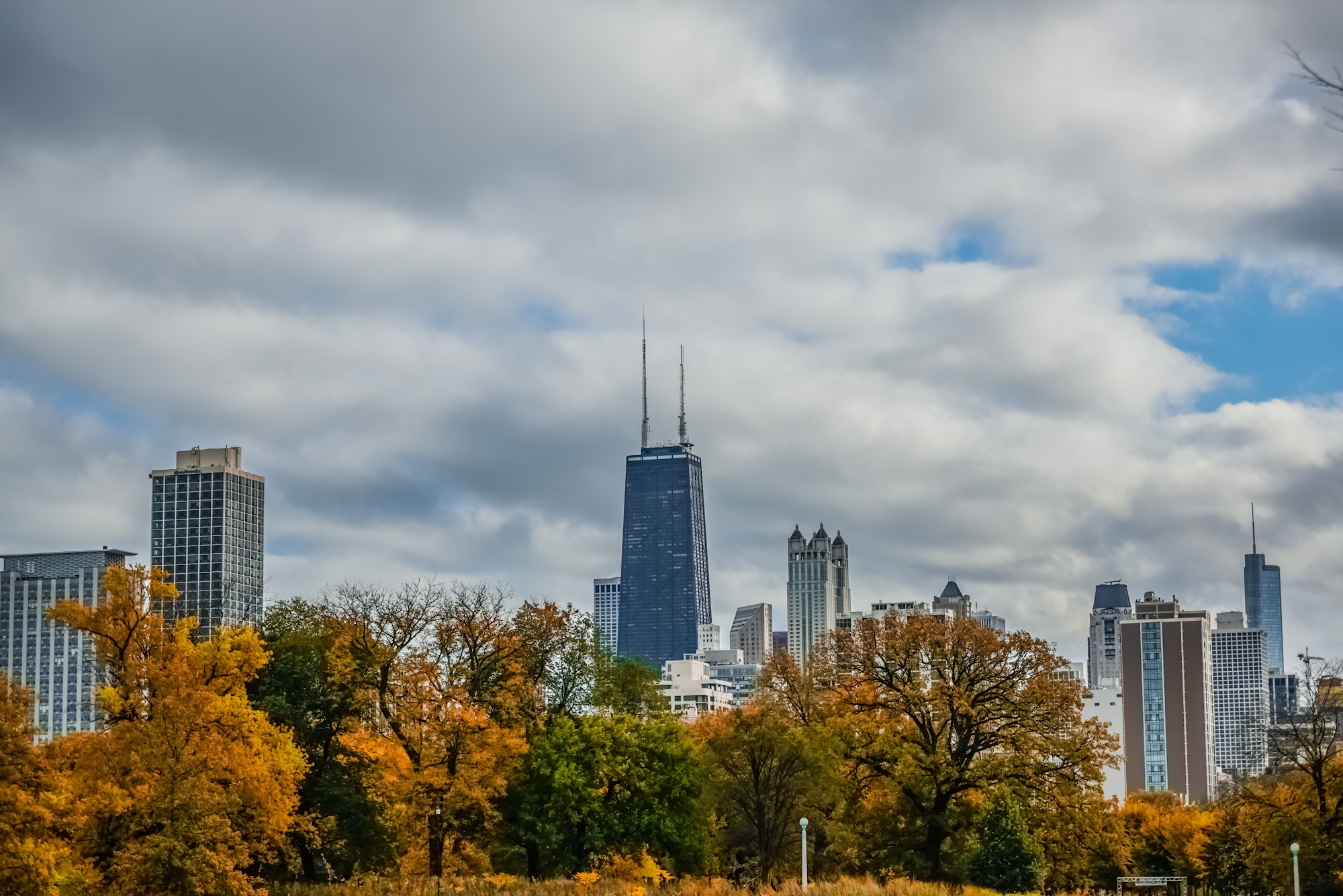 Golden autumn trees in Lincoln Park with Chicago’s skyline beyond